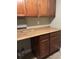 Laundry room with wooden cabinets and countertop space at 1400 Pine Glen Ln # D2, Tarpon Springs, FL 34688