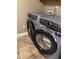 Modern gray Electrolux washer and dryer appliances in the laundry room at 1400 Pine Glen Ln # D2, Tarpon Springs, FL 34688