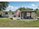 Spacious backyard with a gazebo, featuring seating for Gathering and guests at 1438 Poinciana Dr, Clearwater, FL 33764