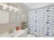 Bathroom with cute fish themed shower curtain and vanity at 1438 Poinciana Dr, Clearwater, FL 33764