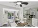 Bright dining area with access to the backyard and a view of the modern kitchen at 1438 Poinciana Dr, Clearwater, FL 33764