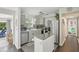 Modern kitchen featuring stainless steel appliances, gray cabinets, and tile backsplash at 1438 Poinciana Dr, Clearwater, FL 33764