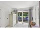 Sun room featuring large sliding glass doors to the back yard at 1438 Poinciana Dr, Clearwater, FL 33764