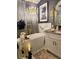 Contemporary bathroom featuring a freestanding tub, gold accents, and elegant decor at 14509 Thornfield Ct, Tampa, FL 33624