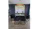 Sophisticated dining room with modern lighting and a glass top table at 14509 Thornfield Ct, Tampa, FL 33624