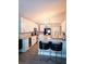 Modern kitchen with white cabinets, granite countertops, and black and gold accents at 14509 Thornfield Ct, Tampa, FL 33624