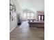 Elegant living room with high ceilings, stylish decor, and views of the backyard pool at 14509 Thornfield Ct, Tampa, FL 33624