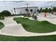 A concrete skate park with artificial turf areas with people using bikes and skateboards at 14509 Thornfield Ct, Tampa, FL 33624