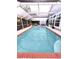 Screened-in pool with brick border and ample space for outdoor relaxation and entertainment at 14509 Thornfield Ct, Tampa, FL 33624