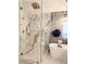 Modern shower with glass enclosure and marble tile at 14509 Thornfield Ct, Tampa, FL 33624