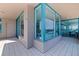 Expansive balcony with sleek tile flooring, offering panoramic views and seamless access to the living area and kitchen at 1520 Gulf Blvd # 1502, Clearwater Beach, FL 33767