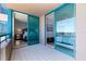 Spacious balcony leading to bedrooms with light tile floor and railing overlooking water at 1520 Gulf Blvd # 1502, Clearwater Beach, FL 33767