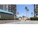 Outdoor basketball court surrounded by lush landscaping, providing a scenic and active recreation space at 1520 Gulf Blvd # 1502, Clearwater Beach, FL 33767