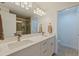 Bathroom with double sink vanity, large mirror, quartz countertop, and glass shower at 1520 Gulf Blvd # 1502, Clearwater Beach, FL 33767