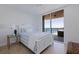 Cozy bedroom featuring large sliding glass doors to the outdoor balcony with water views at 1520 Gulf Blvd # 1502, Clearwater Beach, FL 33767