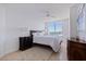 Bedroom featuring tile floor, a ceiling fan, and a large window with an ocean view at 1520 Gulf Blvd # 1502, Clearwater Beach, FL 33767