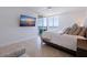 Comfortable bedroom with a view of the ocean from the balcony, perfect for relaxation at 1520 Gulf Blvd # 1502, Clearwater Beach, FL 33767