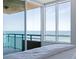 Lovely bedroom showcasing ocean views and balcony access, creating a tranquil retreat at 1520 Gulf Blvd # 1502, Clearwater Beach, FL 33767