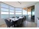 Bright dining room with a marble top table, seating for six, and expansive views of the ocean at 1520 Gulf Blvd # 1502, Clearwater Beach, FL 33767