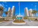 Grand entrance to luxury condos with manicured landscaping and water feature at 1520 Gulf Blvd # 1502, Clearwater Beach, FL 33767