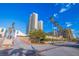 Well-manicured landscaping leading to residential buildings with palm trees at 1520 Gulf Blvd # 1502, Clearwater Beach, FL 33767