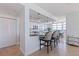 Open-concept kitchen featuring granite counters, stainless appliances, breakfast bar, and ocean views at 1520 Gulf Blvd # 1502, Clearwater Beach, FL 33767