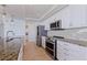 Kitchen featuring stainless steel appliances, granite counters, and ample cabinet space at 1520 Gulf Blvd # 1502, Clearwater Beach, FL 33767