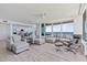 Bright and airy living room with floor to ceiling windows showcasing ocean views and upscale neutral furnishings at 1520 Gulf Blvd # 1502, Clearwater Beach, FL 33767