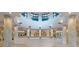 Enter the grand lobby with marble pillars and an upper circular walkway at 1520 Gulf Blvd # 1502, Clearwater Beach, FL 33767