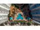 Aerial view of the pool deck surrounded by tropical landscaping at 1520 Gulf Blvd # 1502, Clearwater Beach, FL 33767
