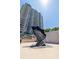 Modern condo building featuring an artistic outdoor sculpture on a sunny day at 1520 Gulf Blvd # 1502, Clearwater Beach, FL 33767