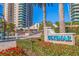 Ultimar community sign framed by colorful flowers and tropical landscaping at 1520 Gulf Blvd # 1502, Clearwater Beach, FL 33767