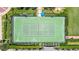 Aerial view of tennis courts showing meticulous landscaping and community layout at 1520 Gulf Blvd # 1502, Clearwater Beach, FL 33767