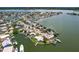 Panoramic aerial view showcasing waterfront homes with private docks and lush landscaping at 17444 2Nd E St, Redington Shores, FL 33708