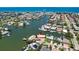 Scenic aerial view showcasing a waterfront community with boating access and map marker at 17444 2Nd E St, Redington Shores, FL 33708