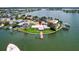 Wide aerial shot of a waterfront neighborhood with boating access and map marker at 17444 2Nd E St, Redington Shores, FL 33708