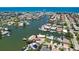 Scenic aerial view showcasing a waterfront community with boating access to the ocean at 17444 2Nd E St, Redington Shores, FL 33708