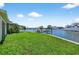 Well-maintained backyard featuring a canal view and a private dock at 17444 2Nd E St, Redington Shores, FL 33708