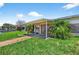 Home with a covered patio and landscaping near canal at 17444 2Nd E St, Redington Shores, FL 33708