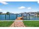 Private wooden dock with a boat lift on the canal at 17444 2Nd E St, Redington Shores, FL 33708
