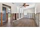 Living room with view to waterfront, tile floor, and ceiling fan at 17444 2Nd E St, Redington Shores, FL 33708