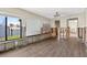 Bright living room with tile floors and water view through windows at 17444 2Nd E St, Redington Shores, FL 33708