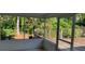 Relaxing screened porch with a view of the garden, perfect for enjoying the outdoors in comfort at 1875 Harmony Dr, Clearwater, FL 33756