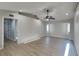 Bright bedroom with hardwood floors, a ceiling fan, natural light, and updated fixtures at 23344 Van Buren Ave, Punta Gorda, FL 33980