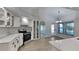 Modern kitchen with white cabinets, stainless steel appliances, quartz countertops, and updated fixtures at 23344 Van Buren Ave, Punta Gorda, FL 33980