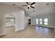 Bright living room with hardwood floors, high ceilings, elegant arched doorways, and natural light at 23344 Van Buren Ave, Punta Gorda, FL 33980