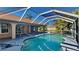 Relaxing pool enclosed by a screen featuring a clear blue sky and lots of sunlight at 23344 Van Buren Ave, Punta Gorda, FL 33980