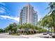 Upscale high-rise building with beautiful architectural details, curved balconies, and manicured landscaping at 288 Beach Ne Dr # 12C, St Petersburg, FL 33701
