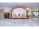 Elegant lobby featuring a marble floor, two chairs, and a decorative wall with 'The Cloisters' logo at 288 Beach Ne Dr # 12C, St Petersburg, FL 33701