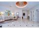 Inviting lobby area with marble floors, contemporary furniture, artwork, and access to elevators at 288 Beach Ne Dr # 12C, St Petersburg, FL 33701
